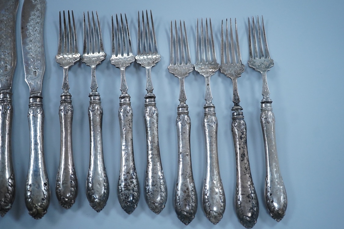 Eight Victorian silver fish forks and seven fish knives, by Hilliard & Thomason, Birmingham, 1878, with loaded unmarked white metal handles, one a plated replacement.